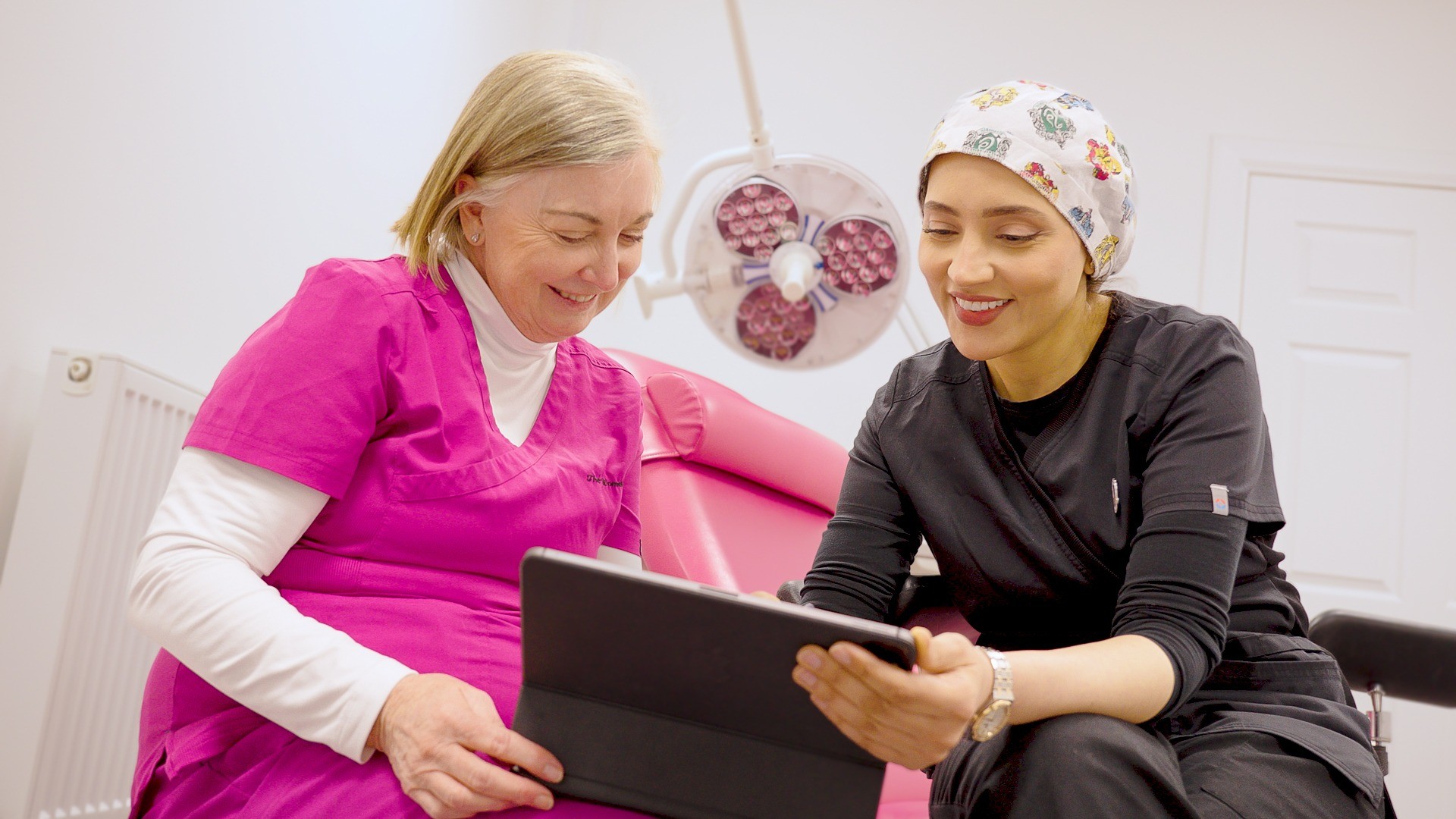 Amanda Pook and Dr Hala Elgmati reviewing information together at The Women’s Clinic